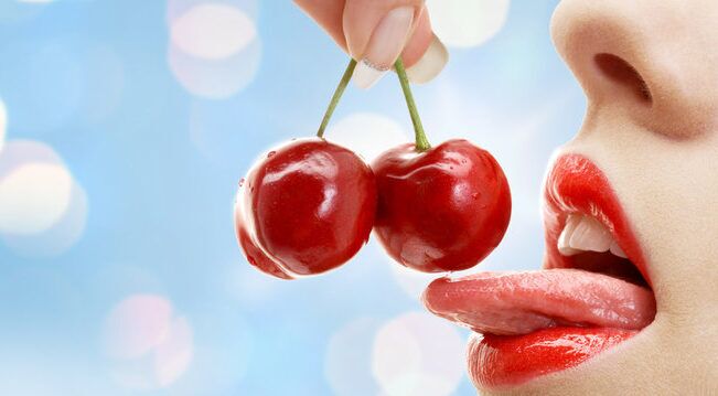 woman eating cherries